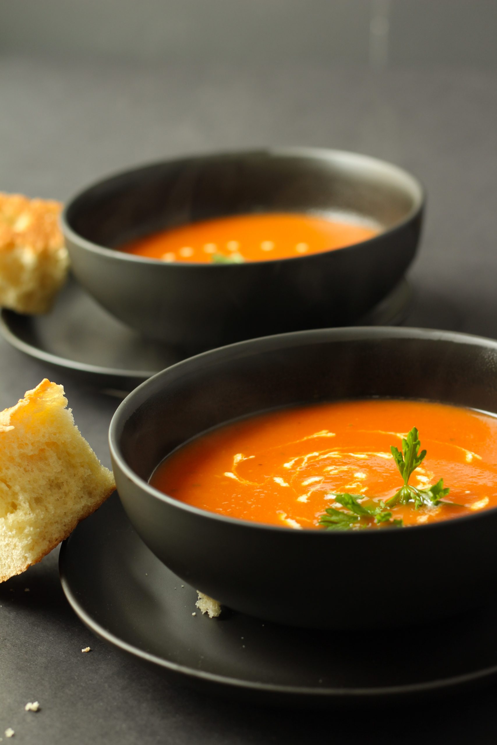 Tomato soup with garnish and heavy cream