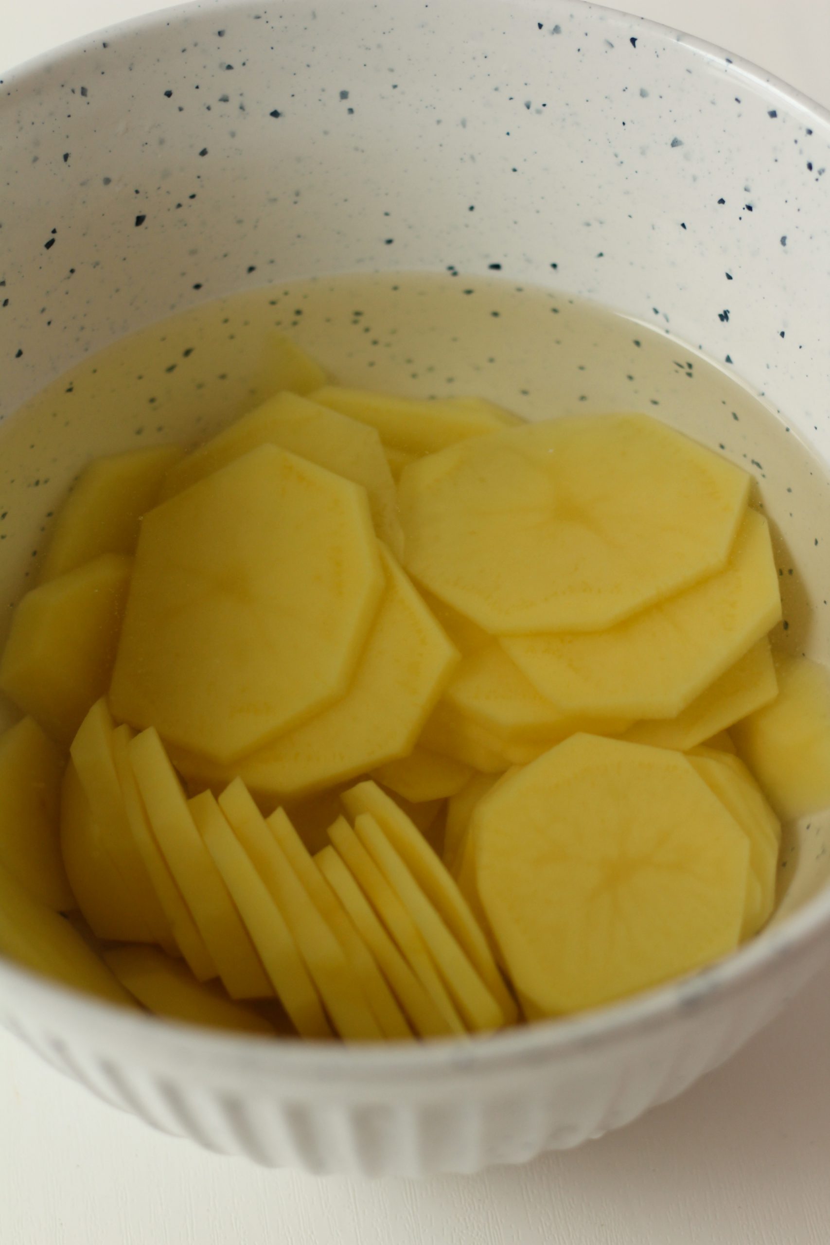 Potatoes soaking in cold water