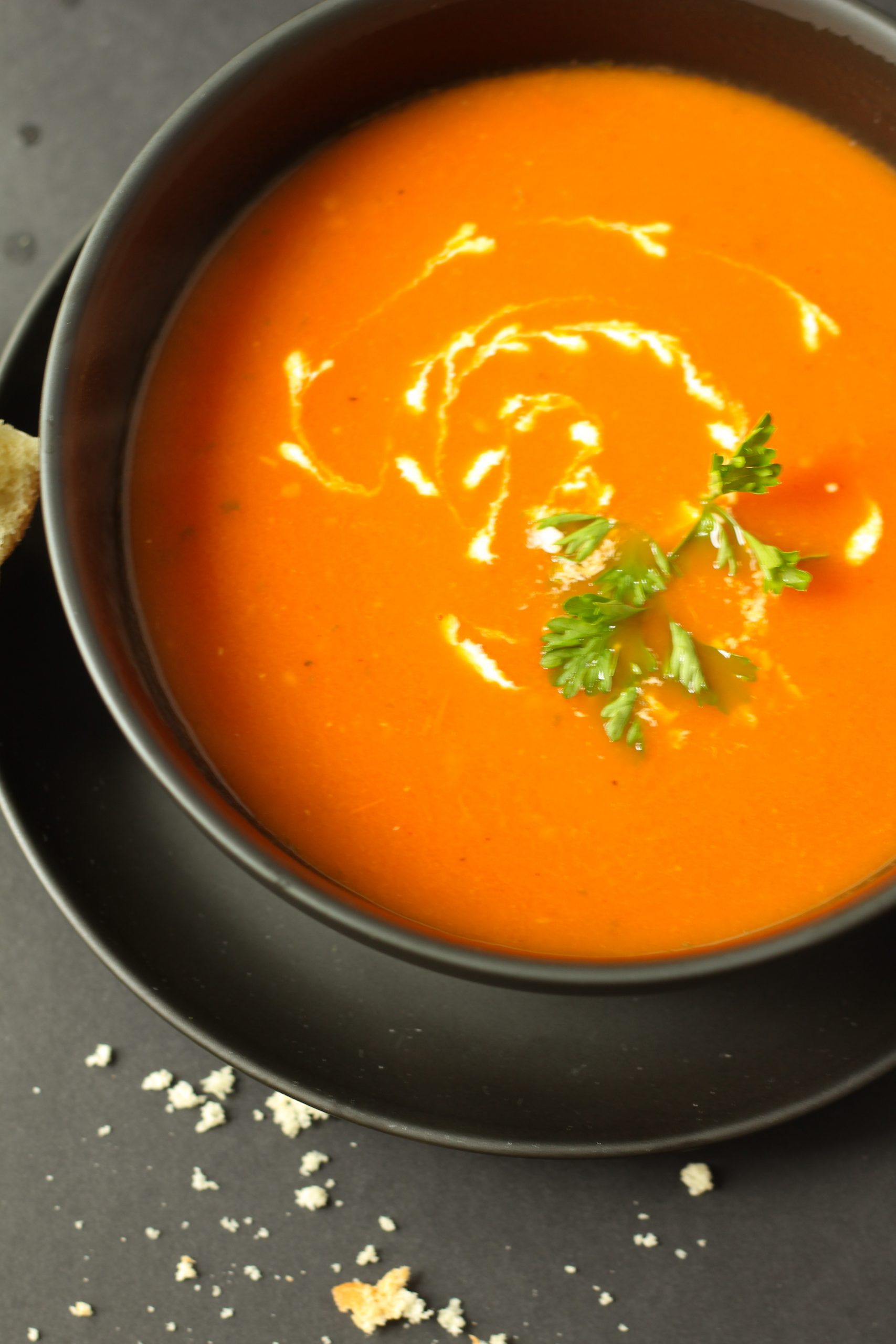 Tomato soup with garnish and heavy cream